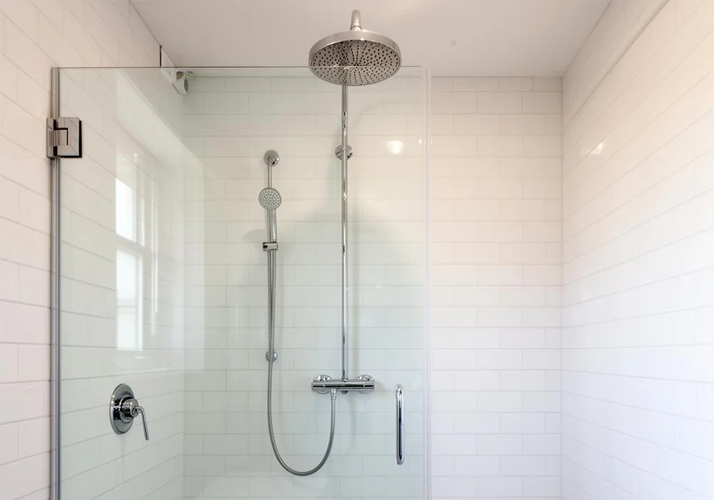 Pedro Lima plumber working on a residential bathroom installation in Massachusetts